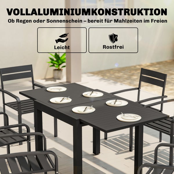 Gartenmöbel-Set aus Vollaluminium mit ausziehbarem schwarzem Tisch und Stühlen auf einer Terrasse, wetterfest, rostfrei und leicht.