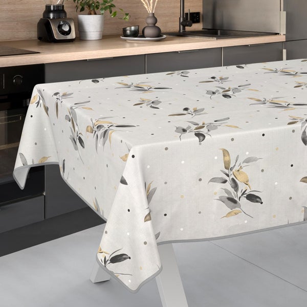 Rechteckige Tischdecke mit Olivenzweig-Muster und Punkten auf einem Tisch in einer modernen, organisierten Küche.