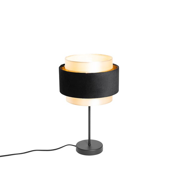 Moderne Tischleuchte mit schwarzem Metallfuß und zweistufigem Textilschirm in Schwarz und Gold.