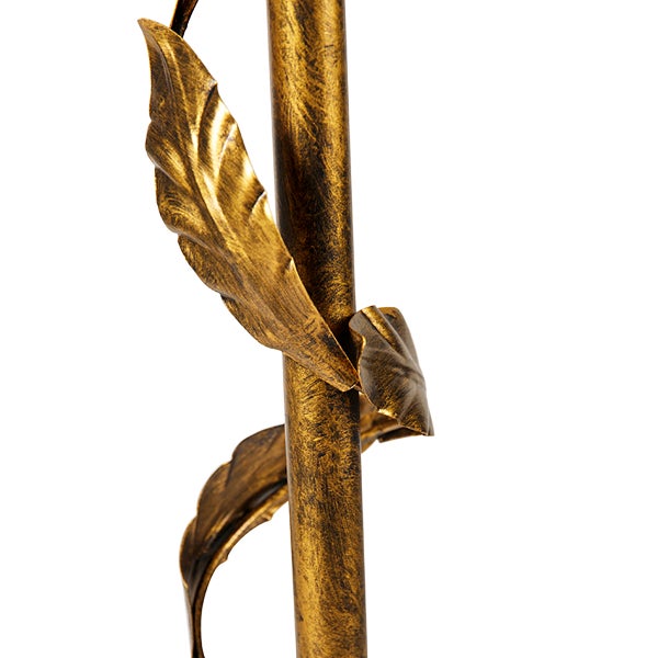 Detailaufnahme eines Lampenfußes mit dekorativen Blättern