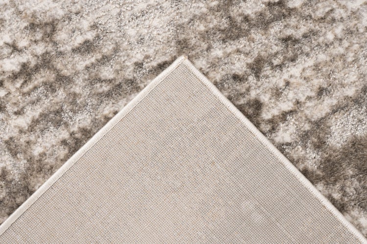 Teppich mit gemusterter Oberseite und strukturierter Rückseite aus Textil