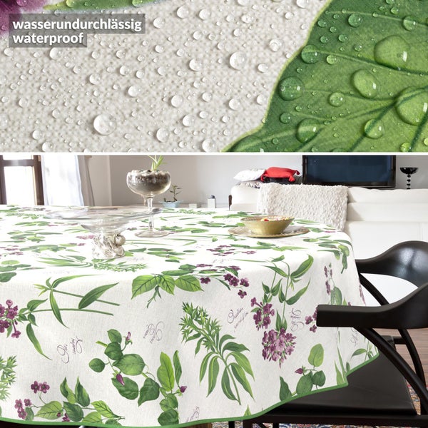 Wasserundurchlässige runde Tischdecke mit botanischem Blätter- und Blütenmuster auf einem Esstisch in einem hellen Wohnzimmer.