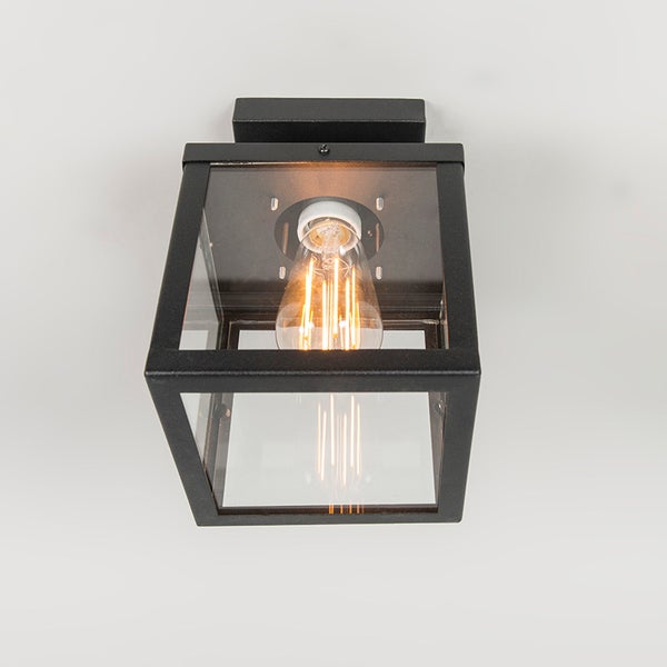 Schwarze rechteckige Deckenleuchte mit klaren Glasscheiben und einem leuchtenden LED-Filament-Leuchtmittel.