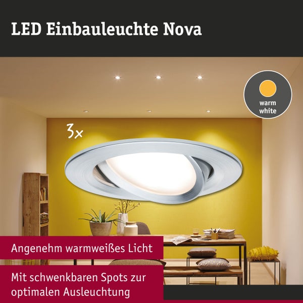 Schwenkbare LED Einbauleuchte Nova im 3er Set mit warmweißem Licht in einem modern eingerichteten Raum mit Holzmöbeln.