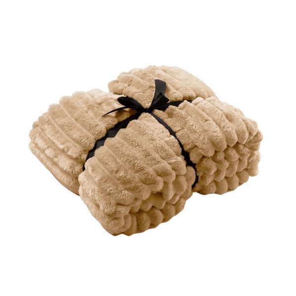 Zusammengelegte Kuscheldecke mit Schleife