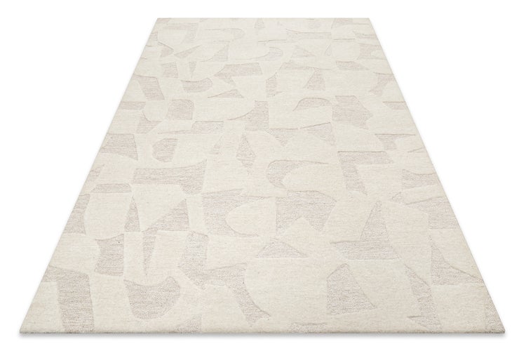 Strukturierter beigefarbener Teppich mit abstrakten geometrischen Mustern und Hoch-Tief-Struktur.