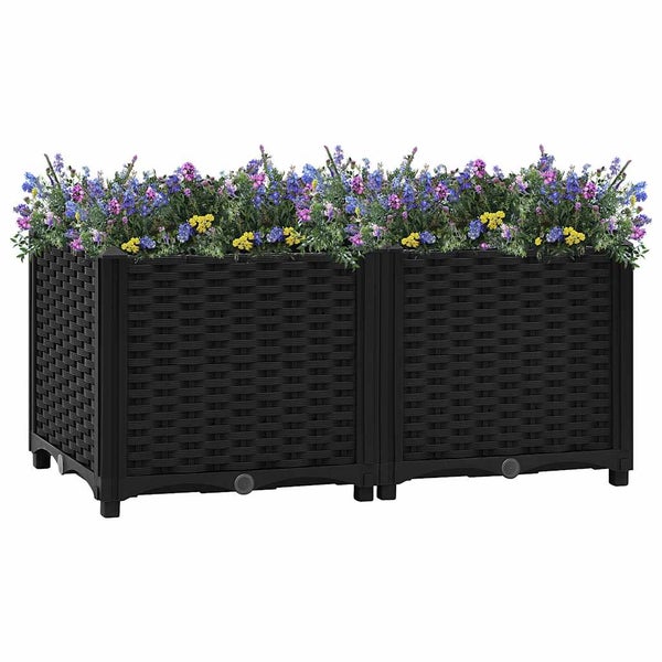 Rechteckiges Hochbeet in Anthrazit aus Kunststoff in Rattanoptik, bepflanzt mit Blumen.