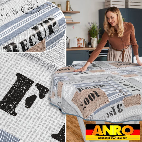 Frau deckt einen runden Tisch mit einer beschichteten ANRO Tischdecke mit Patchwork Muster.