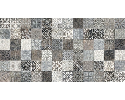 Fliese mit grauem Patchwork Muster aus verschiedenen Ornamenten im Vintage Design.