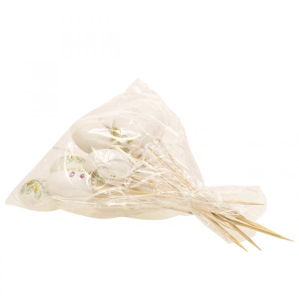 Dekorative Ostereier am Holzstab mit Blumenmuster in Folie verpackt