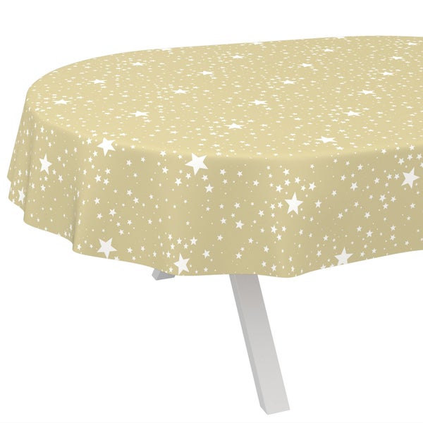 Ovale Tischdecke mit weißen Sternen auf beigem Grund auf einem Tisch