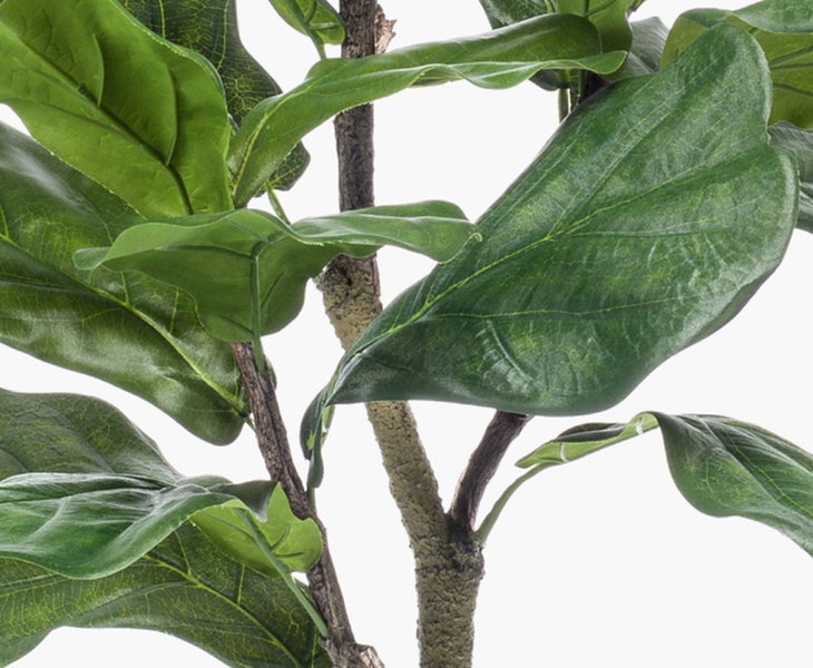 Künstliche Magnolie mit grünen Blättern, braunen Unterseiten und verzweigtem Stamm.