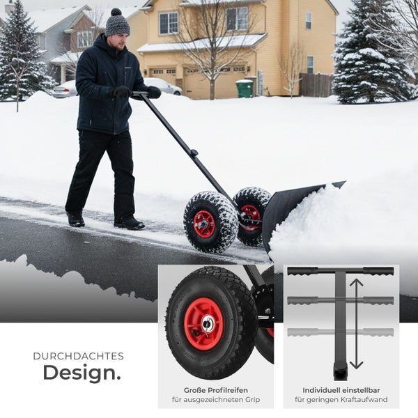 Eine Person benutzt eine Schneeschaufel mit Rädern, um Schnee von einer Auffahrt zu entfernen.