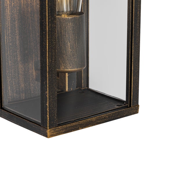 Detailaufnahme einer antik-bronzefarbenen Außenwandleuchte aus strukturiertem Metall mit Glasscheiben.