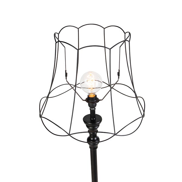 Stehleuchte mit einem Lampenschirm aus Draht und einer Glühbirne