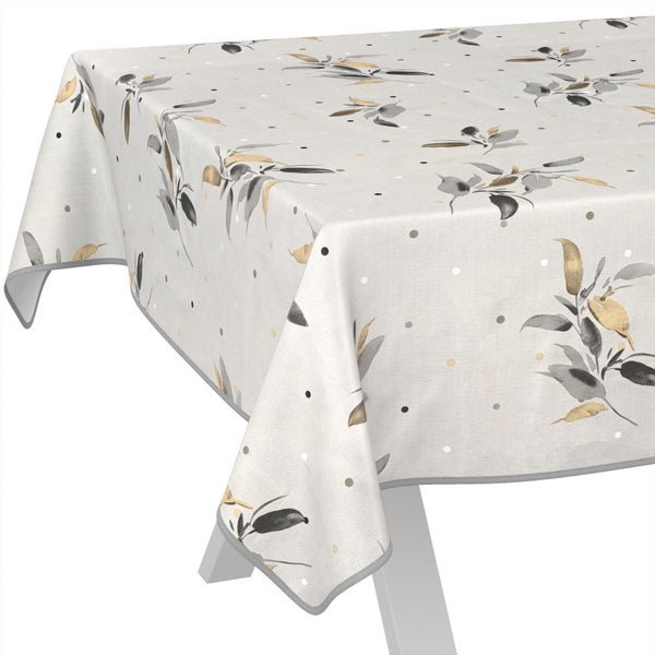 Abwaschbare Tischdecke in Weiß, Grau und Gold mit Blattmuster und Punkten.