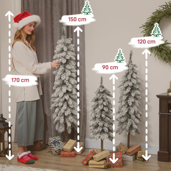 Drei künstliche, beschneite Weihnachtsbäume in den Höhen 90, 120 und 150 Zentimeter neben einer Person zum Größenvergleich in einem hellen Raum.