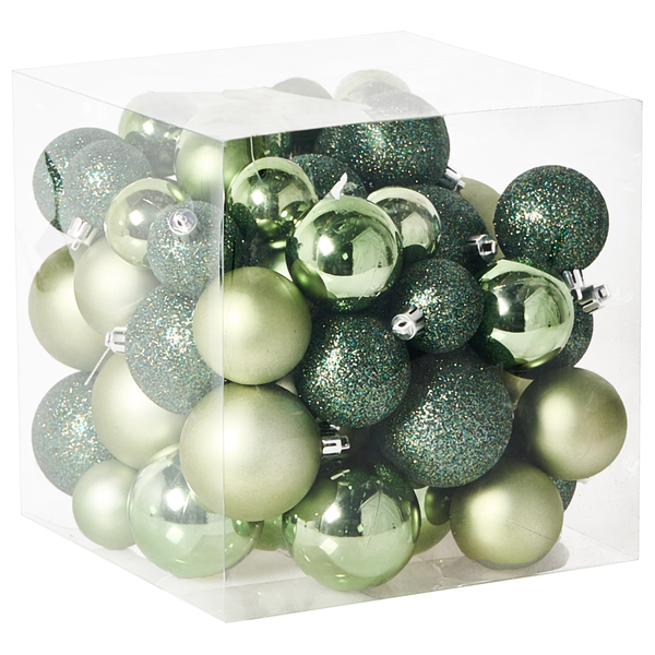 Kiste mit grünen Weihnachtskugeln