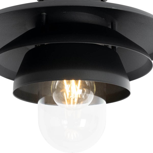 Schwarze Außenleuchte mit abgestuftem Metallschirm, Glaskuppel und leuchtendem LED-Filament-Leuchtmittel.