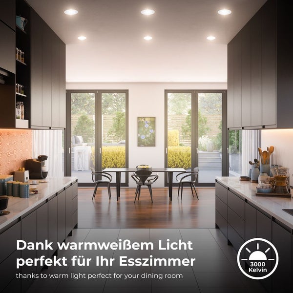 Esszimmer mit Einbauspots und schwarzer Küchenzeile