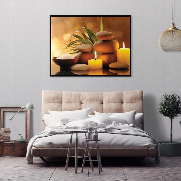 Wandbild mit Wellnessmotiv von Zen Steinen und Kerzen über einem gepolsterten Bett in einem modernen Schlafzimmer mit Pendelleuchte.