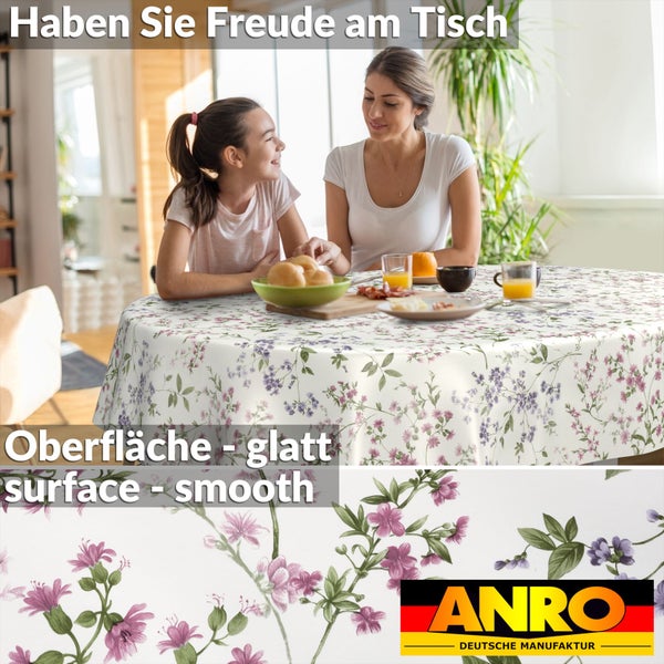 Runde Tischdecke mit Blumenmuster und glatter Oberfläche in einer hellen Esszimmerszene. ANRO Logo.