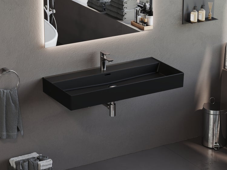 Badezimmer mit schwarzem Waschbecken, Armatur und Spiegel mit Beleuchtung