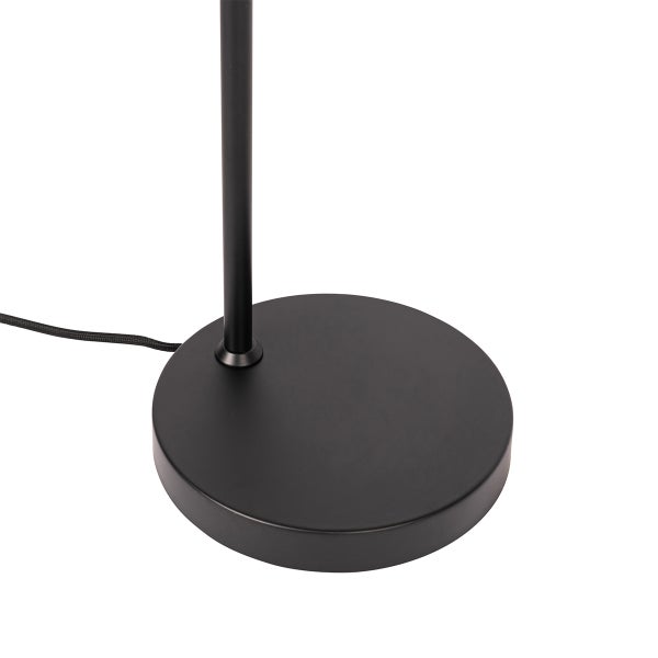 Runder Lampenfuß einer Leuchte mit Textilkabel und Standrohr in Schwarz.