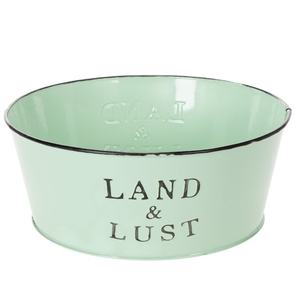 Runde Pflanzschale aus Metall in Mintgrün mit schwarzem Rand und dem Aufdruck Land und Lust.
