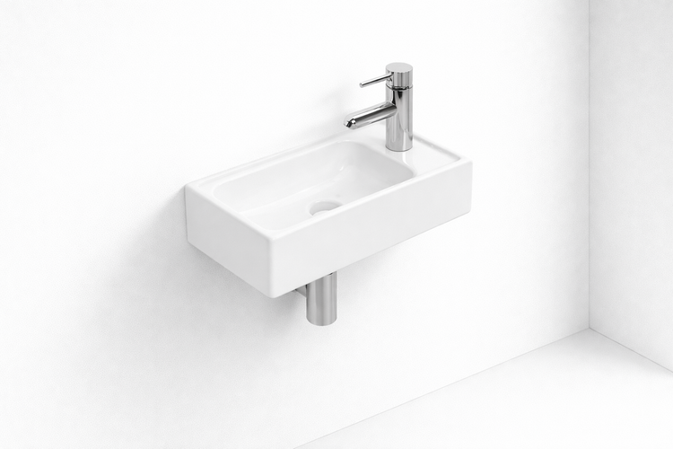 Rechteckiges Aufsatzwaschbecken mit Armatur an einer weissen Wand