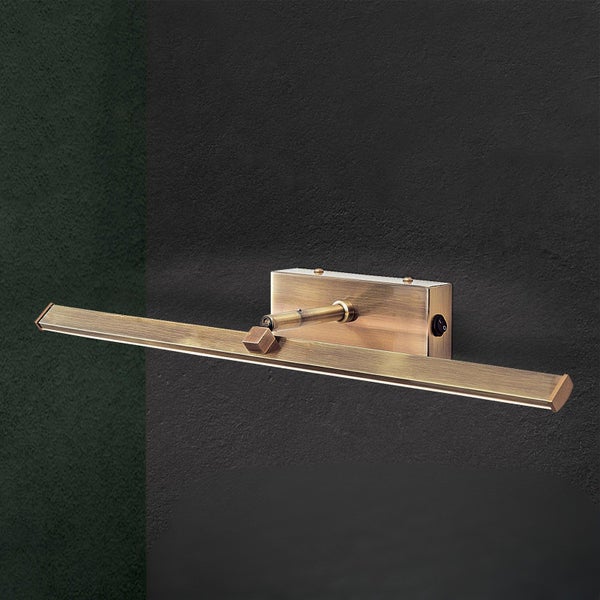 Moderne LED Bildleuchte in messingfarbener Optik mit Schalter zur Wandmontage