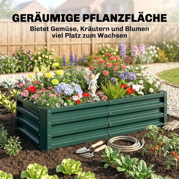 Grünes Hochbeet aus Metall in einem Garten, bepflanzt mit bunten Blumen und einer kleinen Figur, davor Gartenwerkzeuge auf der Erde.