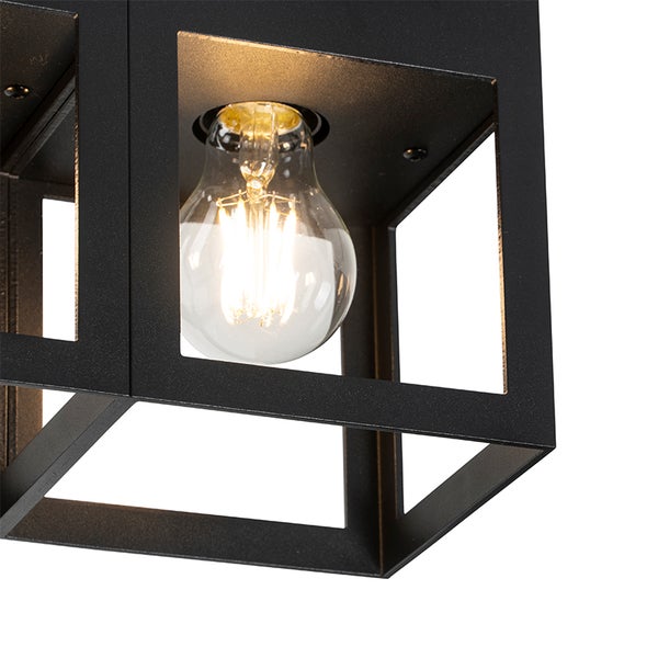 Nahaufnahme einer schwarzen Außenleuchte mit einer Glühbirne