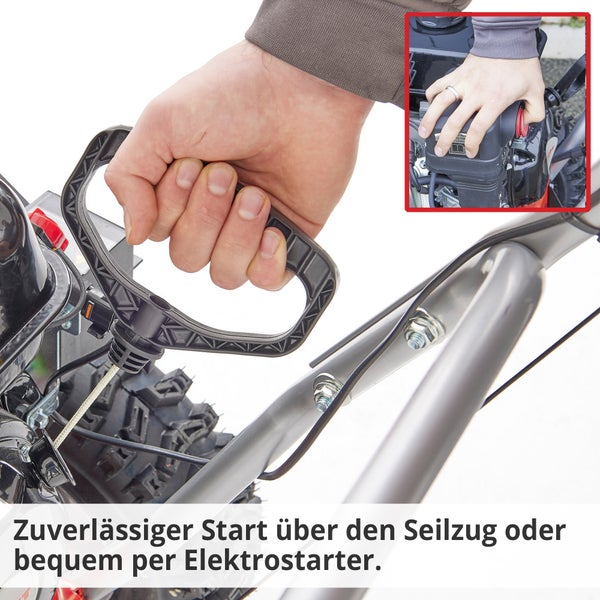 Detailaufnahme eines Seilzugs und eines Elektrostarter-Knopfs an einer Schneefräse, die einen zuverlässigen Start ermöglichen.
