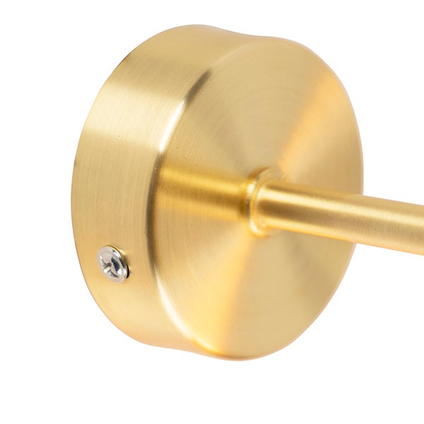 Detailansicht einer goldenen Wandleuchte