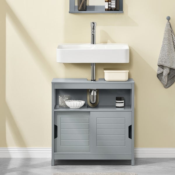 Waschtisch mit Unterschrank, Aufbewahrung, Waschbecken und Armatur in einem Badezimmer