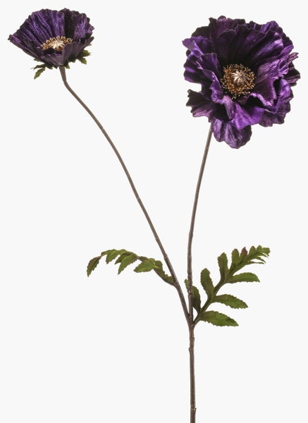 Künstliche Magnolienblüte am Zweig aus Textilmaterial in Dunkelrosa.