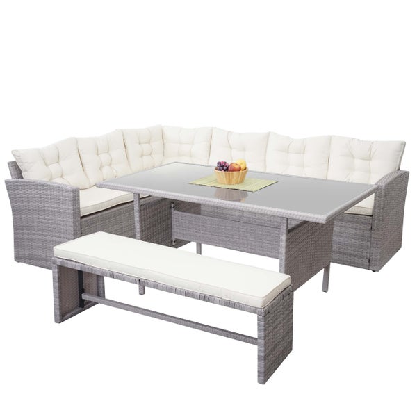 Gartenmöbel-Set aus Polyrattan bestehend aus einem Ecksofa, einem Esstisch mit Glasplatte und einer Sitzbank inklusive Auflagen.