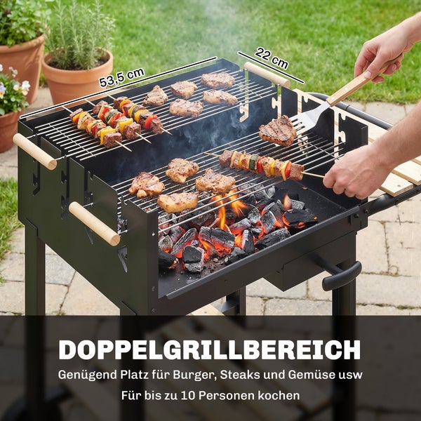 Doppel-Holzkohlegrill mit zwei Grillflächen von 53,5 Zentimeter mal 22 Zentimeter für bis zu 10 Personen, mit Fleisch und Gemüsespießen.
