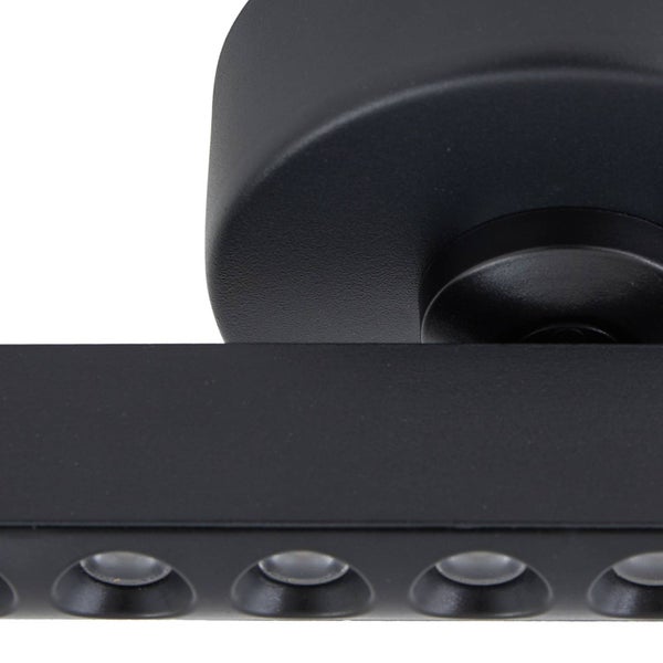 Detailaufnahme einer schwarzen LED-Leuchte mit runder Halterung und rechteckigem Gehäuse.