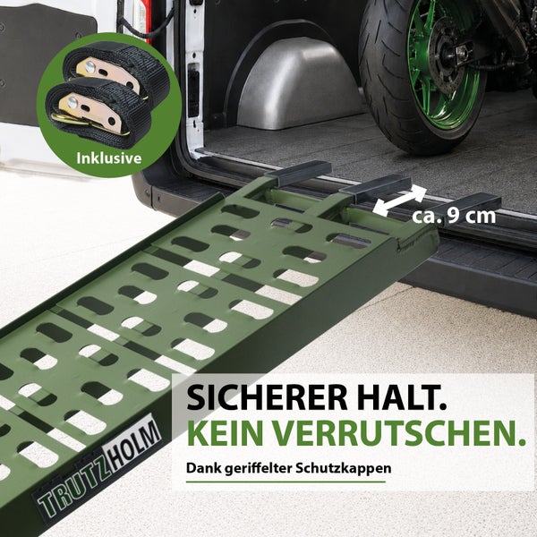 Trutzholm Auffahrschiene am Fahrzeugheck mit circa 9 Zentimeter langen geriffelten Schutzkappen, inklusive zwei Verzurrgurten.