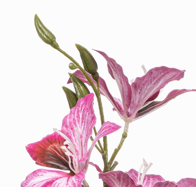 Künstlicher Orchideenzweig mit pinkfarbenen Blüten und grünen Blättern.