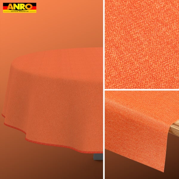 ANRO Logo. Orangefarbene, strukturierte Tischdecke aus Stoff, Detailansicht der Oberfläche und Fall auf einem Tisch.