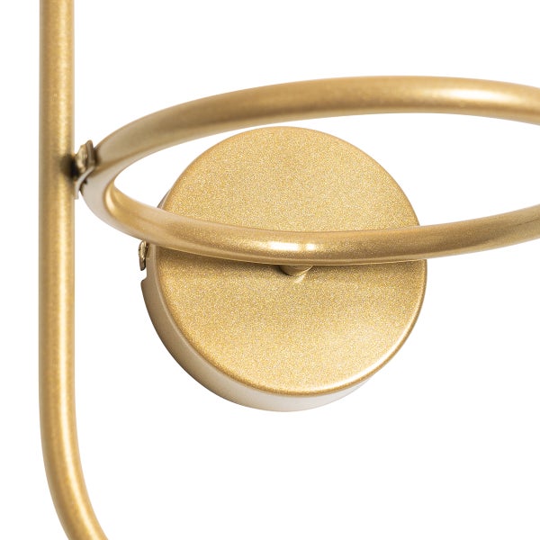 Detail einer goldenen Wandleuchte