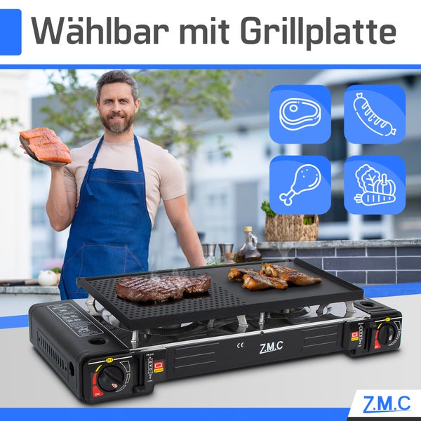 Z.M.C zweiflammiger Gaskocher mit Grillplatte, auf der Fleisch brät. Ein Mann steht dahinter. Wählbar mit Grillplatte. Z.M.C Logo.
