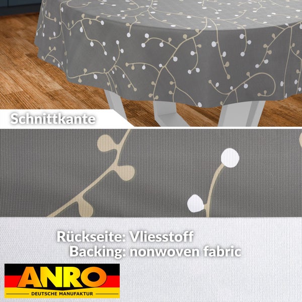 Tischdecke mit floralem Rankenmuster, Rückseite aus Vliesstoff, Detail der Schnittkante, Anro Logo.