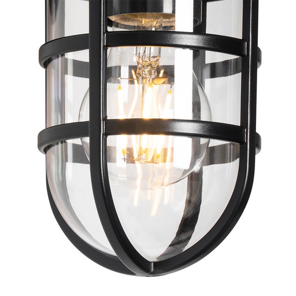 Schwarze Außenleuchte im Industrial-Stil mit Metallgitter, klarem Glas und leuchtendem LED-Filament-Leuchtmittel.
