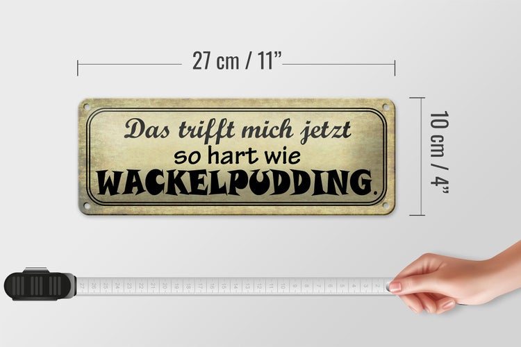 Blechschild Spruch 27x10cm trifft hart wie Wackelpudding Dekoration