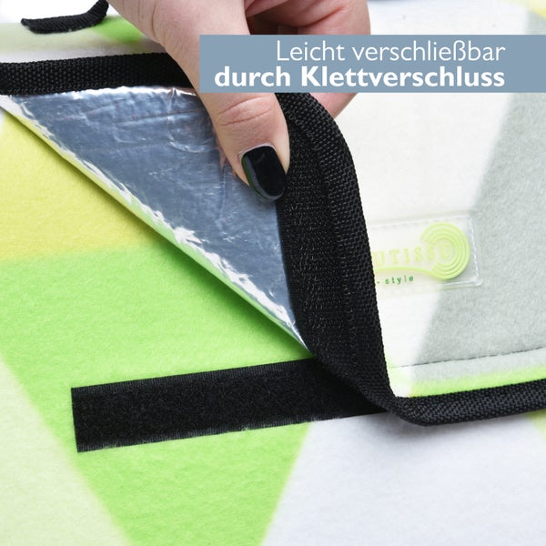 Detailansicht einer Wickelunterlage mit Klettverschluss und Utissu Logo