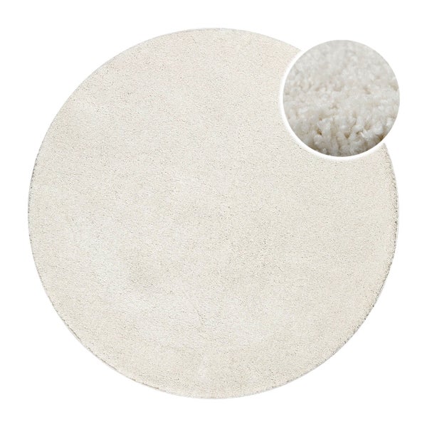 Runder Hochflor-Teppich in Beige mit Detailansicht der weichen Fasern.